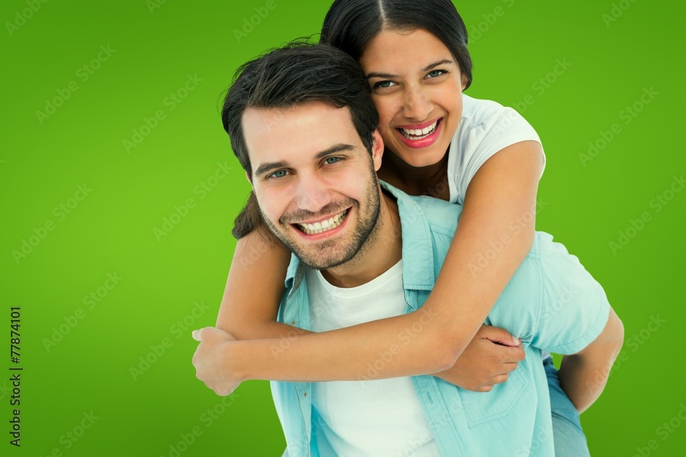 Happy casual man giving pretty girlfriend piggy back Happy casual man giving pretty girlfriend piggy back