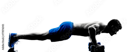 Fototapeta man exercising fitness push ups weights exercises silhouette