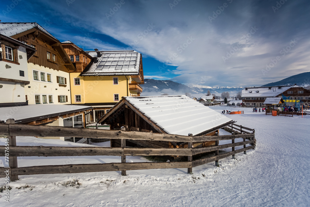 chalet and ski resort in Austrian Alps covered by snow chalet and ski resort in Austrian Alps covered by snow