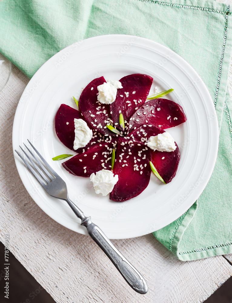 roasted beet salad with goat cheese and sesame seeds, vegetarian