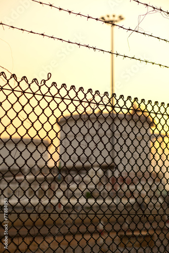 Obraz w ramie wire fence of Fuel Tanks