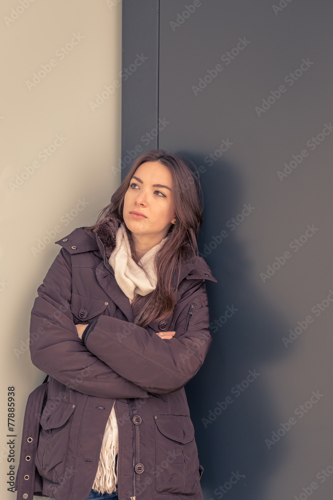 Young beautiful girl posing in the city streets Young beautiful girl posing in the city streets