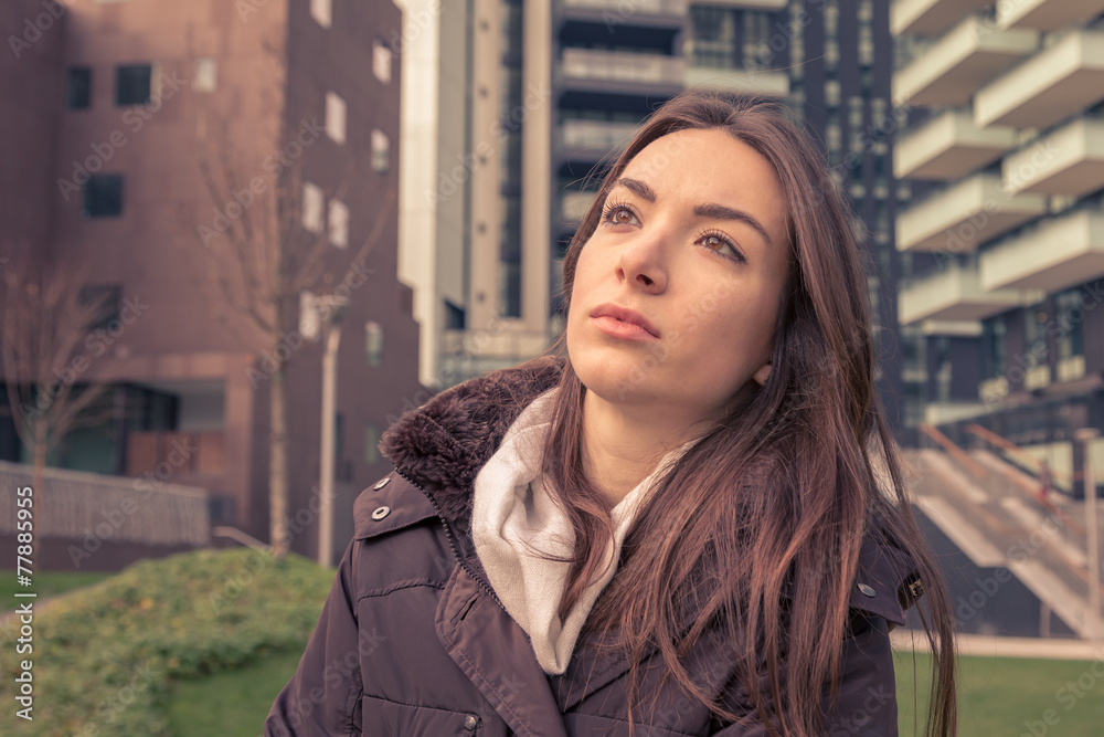Young beautiful girl posing in the city streets Young beautiful girl posing in the city streets