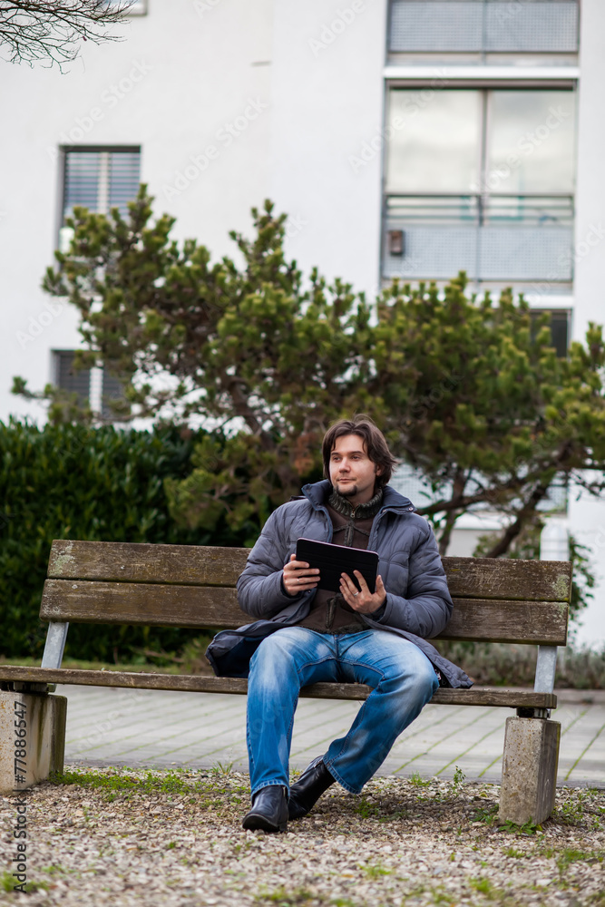 Man with tablet outdoor Man with tablet outdoor