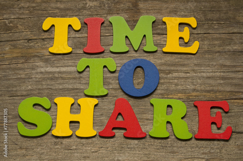 Time to Share text on a wooden background