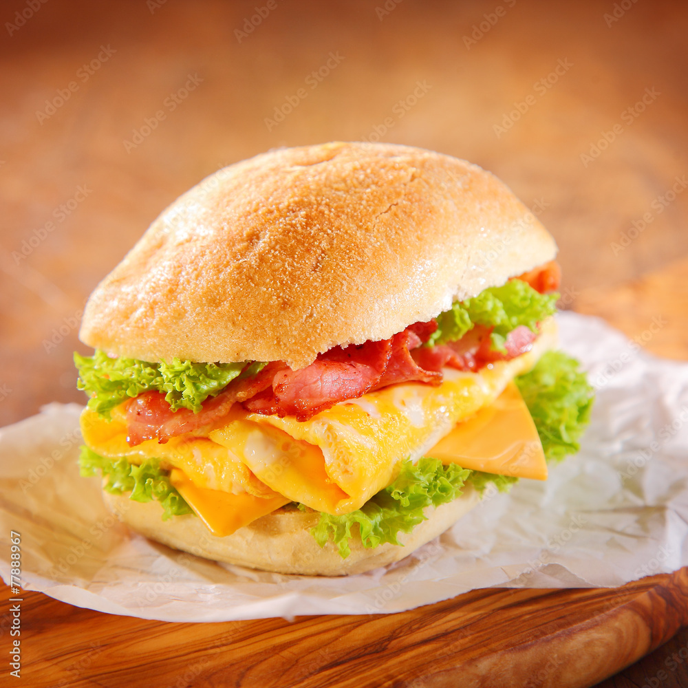 Tasty hamburger with ham, cheese and lettuce Tasty hamburger with ham, cheese and lettuce