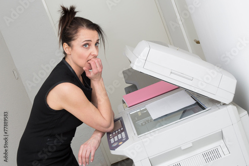 Woman using a copy machine