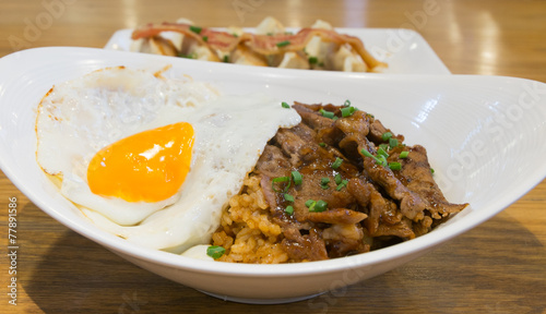 Rice with roast beef  barbecue sauce and fried egg