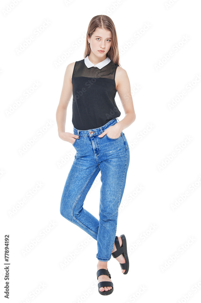 Young fashion girl in jeans posing isolated Young fashion girl in jeans posing isolated