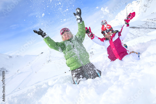 Kids having fun playing in the snow