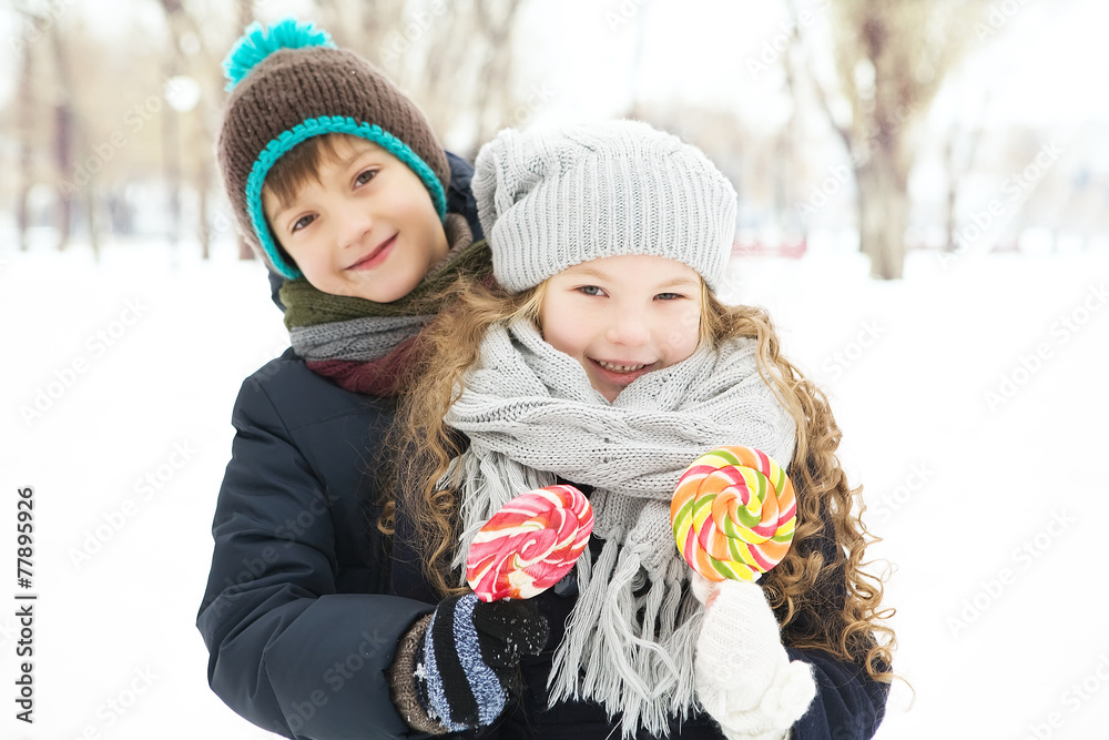 children playing with candy and enjoy the frosty winter