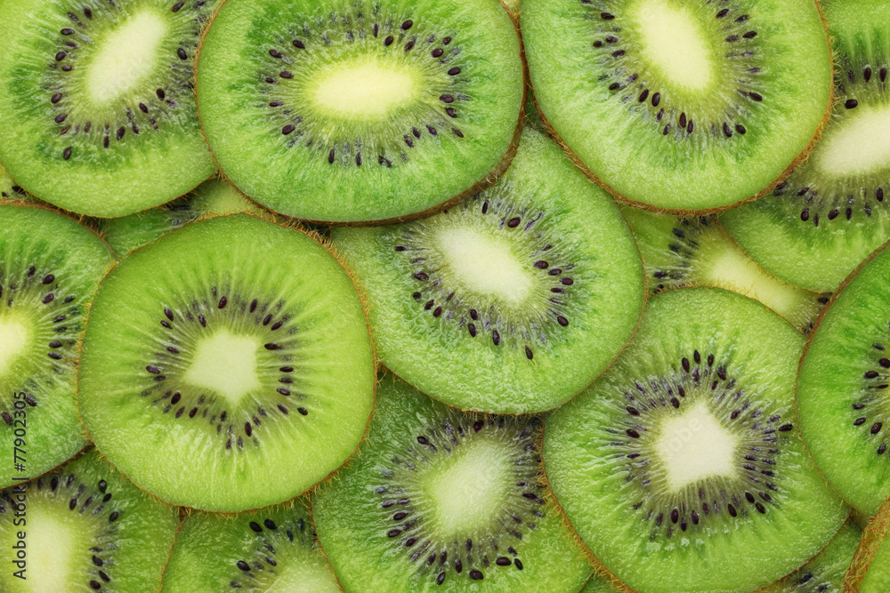 Background made from ripe kiwi slices Background made from ripe kiwi slices
