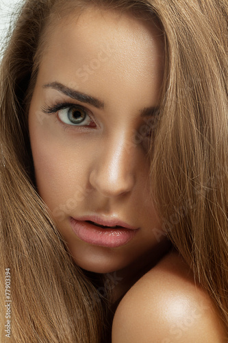 Close up portrait of a beautiful woman with healthy brown hair