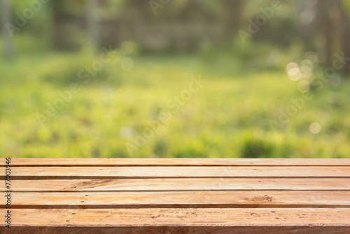 Empty wooden deck table on natural background