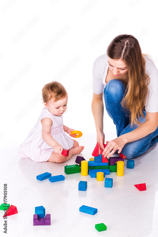 Beautiful baby with mother building with cubes Beautiful baby with mother building with cubes
