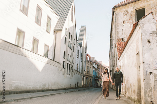Young couple walking in the city in a day © katie_martynova