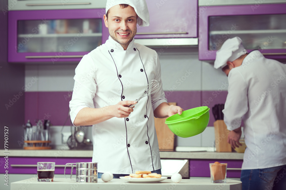 Tiramisu cooking concept. Portrait of two smiling men cooking Tiramisu cooking concept. Portrait of two smiling men cooking
