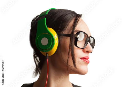 Young Woman wearing Black Large Framed Glasses and Listening to