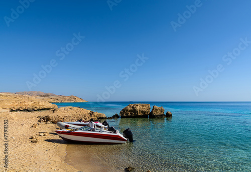 Sunny sand beach and stones on island Tiran in Egyp