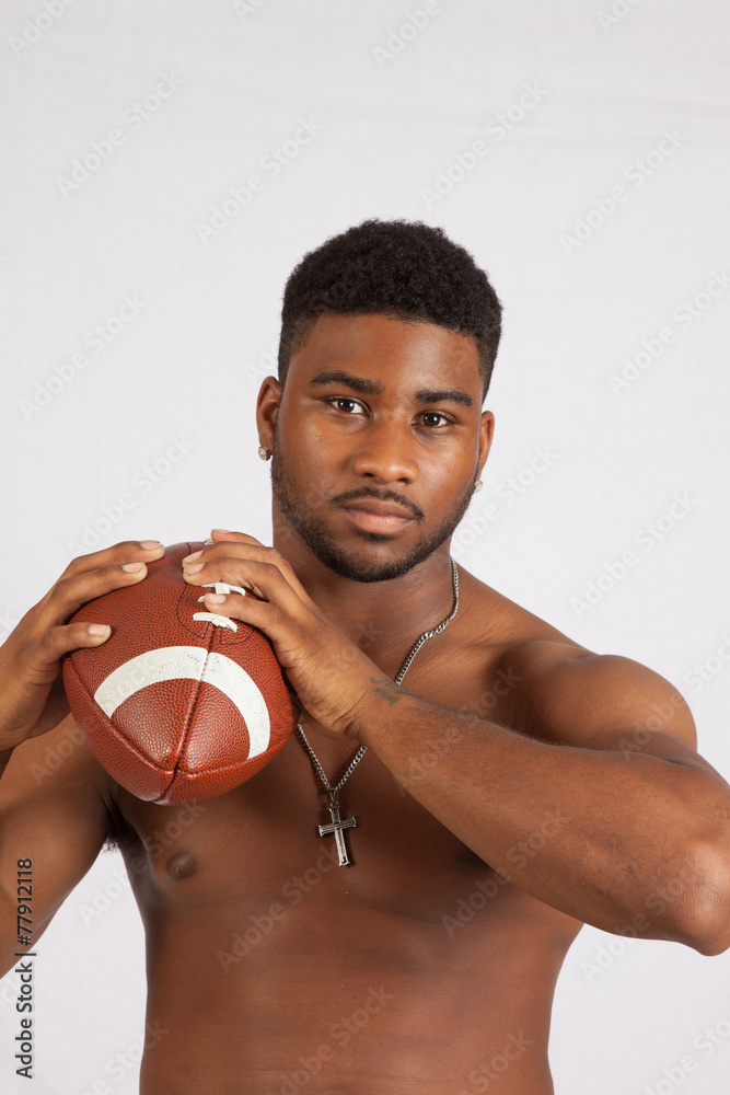 Shirtless black man throwing a football Stock Photo Adobe Stock