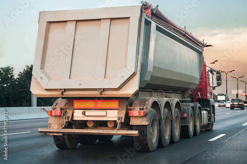 Foto dump truck goes on highway