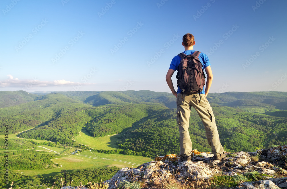 Man on top of mountain. Tourism concept