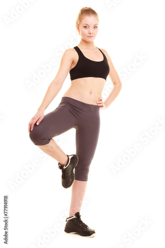 sport. fitness sporty blonde girl stretching leg isolated © Voyagerix