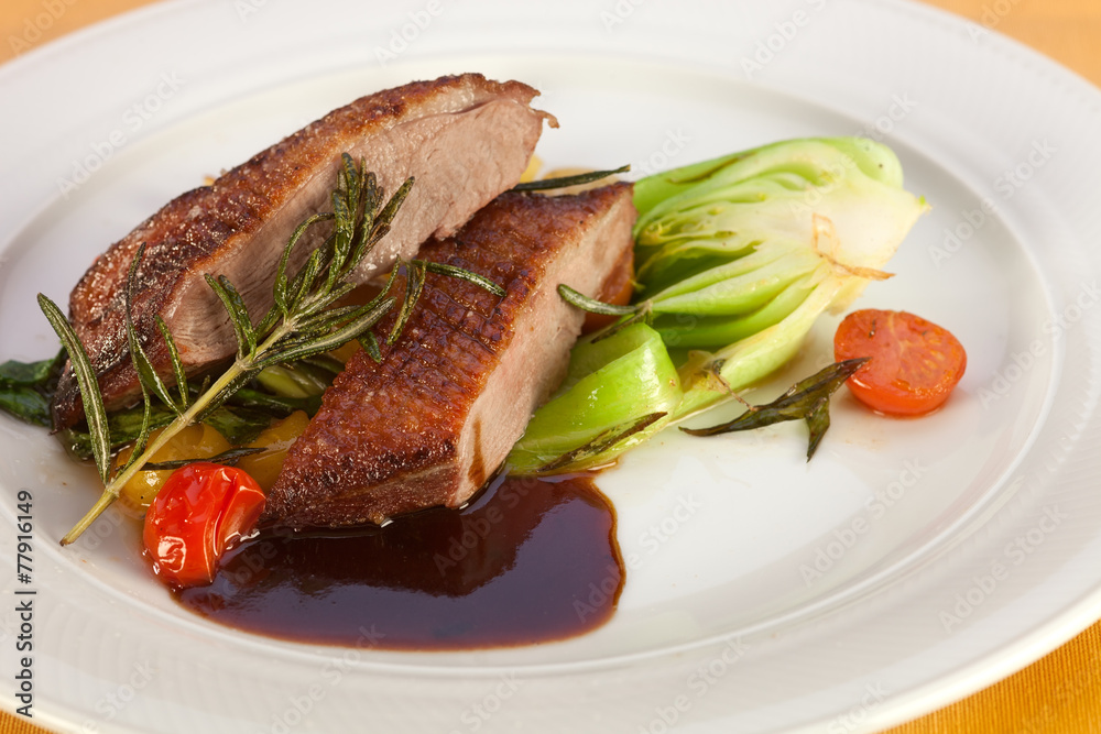 Roasted breast of duck with vegetables. Roasted breast of duck with vegetables.