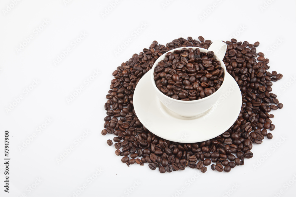 Roasted coffee beans with a cup Roasted coffee beans with a cup
