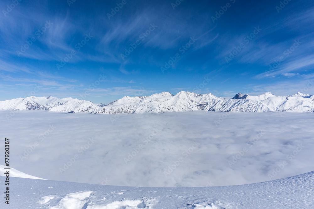 View on mountains and blue sky above clouds