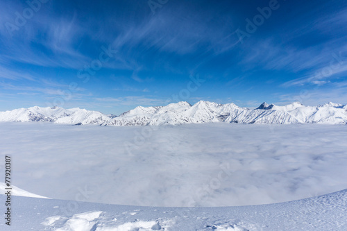 View on mountains and blue sky above clouds