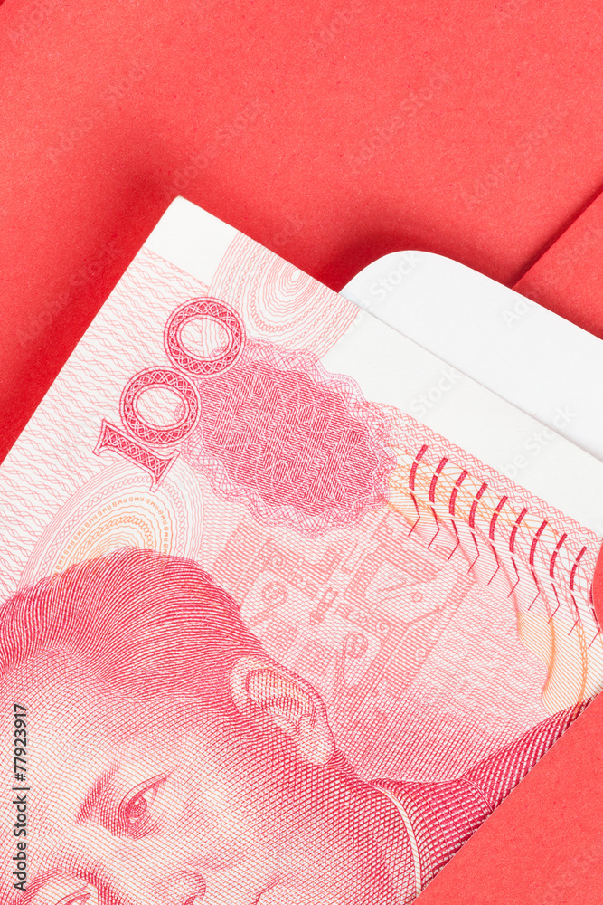 Chinese or 100 Yuan banknotes money in red envelope, as chinese Chinese or 100 Yuan banknotes money in red envelope, as chinese