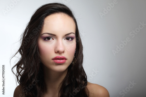Indoor fashion portrait of beautiful young woman