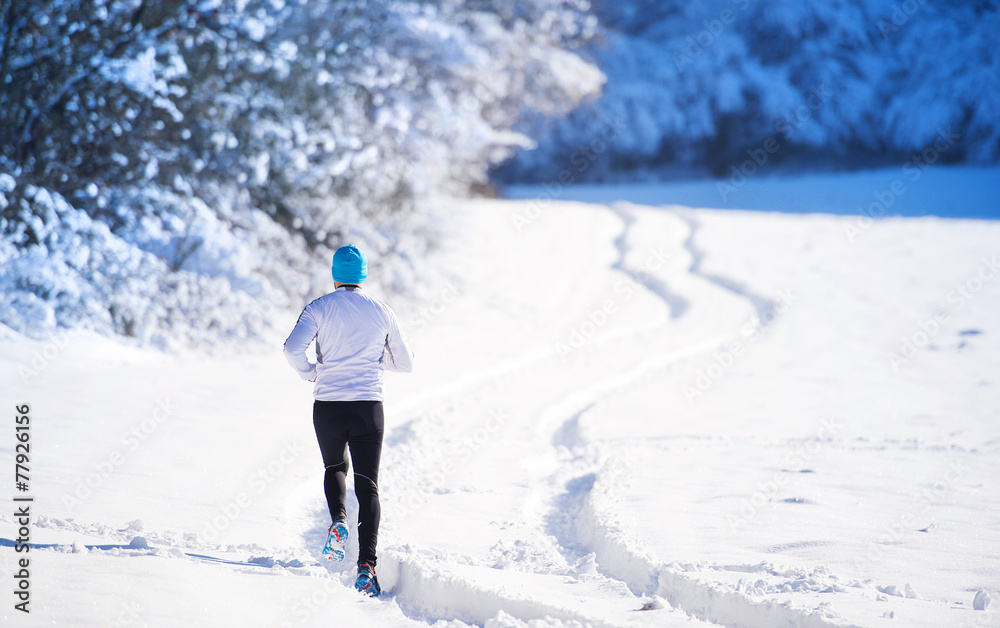 Man jogging in winter nature