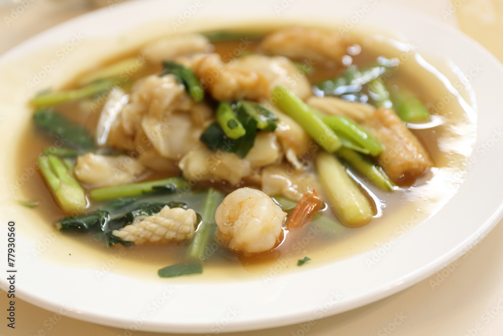 Thai food Wide Noodles in a Creamy Sauce with seafood Thai food Wide Noodles in a Creamy Sauce with seafood