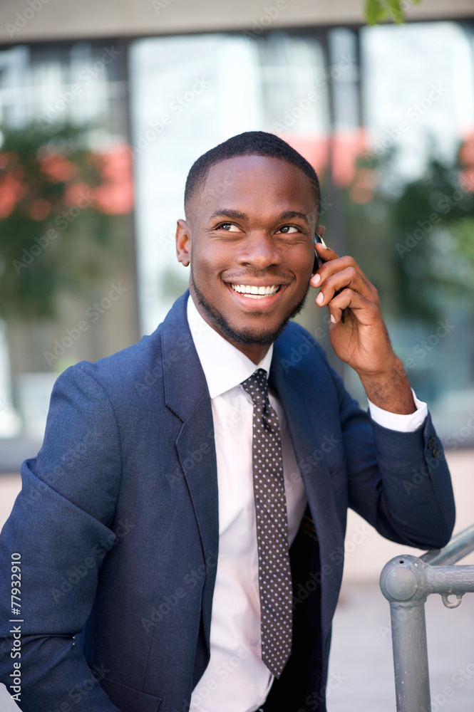Happy confident businessman calling by cell phone Happy confident businessman calling by cell phone