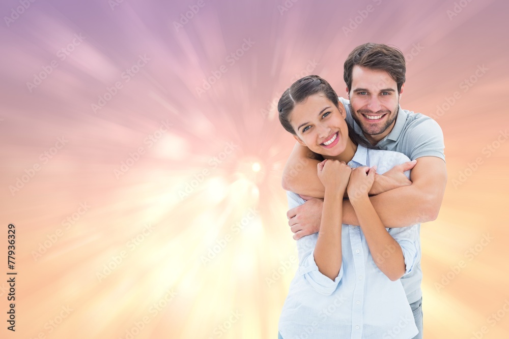 Obraz premium Composite image of cute couple smiling at camera