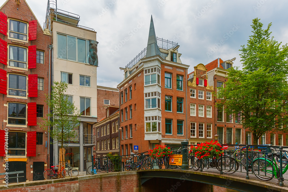 Amsterdam canal and bridge with bikes, Holland, Netherlands