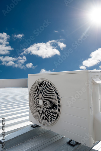 White air conditioning unit on a roof