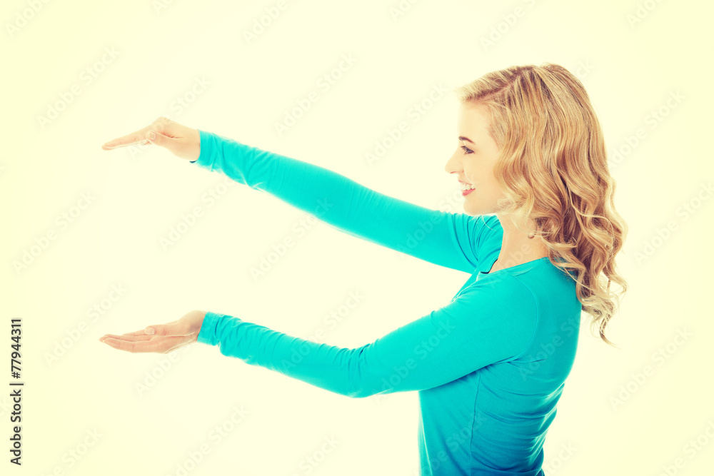 Woman showing something or copyspase Woman showing something or copyspase