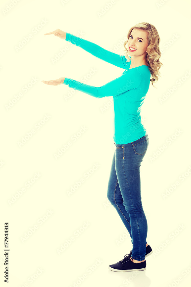 Woman showing something or copyspase Woman showing something or copyspase