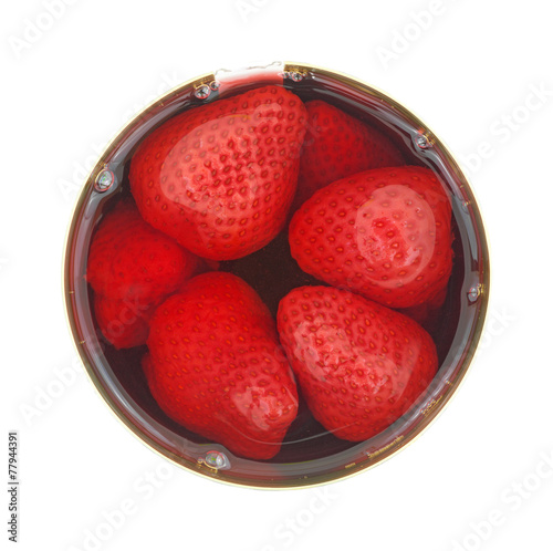 Opened can of strawberries photo