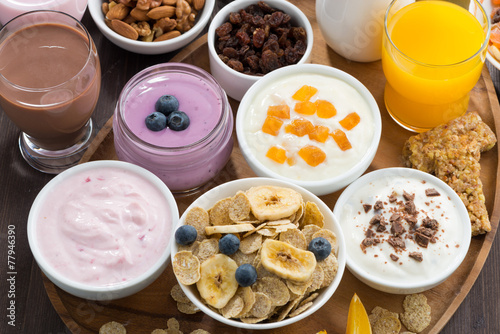 rich breakfast buffet with cereals, yoghurt and fruit