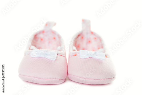 Pink baby sneakers closeup isolated