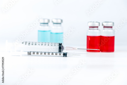 Disposable syringe and injection vials