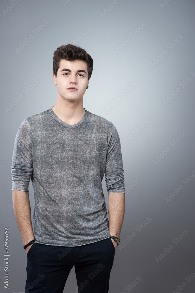 Cool guy posing hands in pockets Cool guy posing hands in pockets