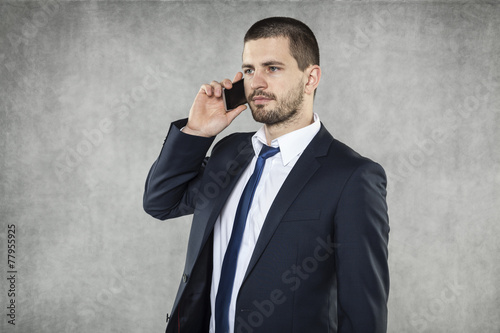 Photography serious businessman talking on the phone