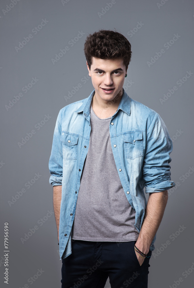 Fototapeta premium Teenager posing with hands in pockets