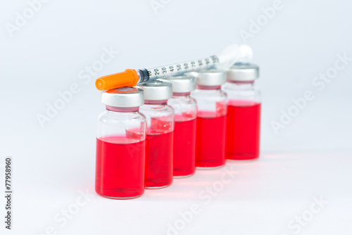 Disposable syringe on injection vials