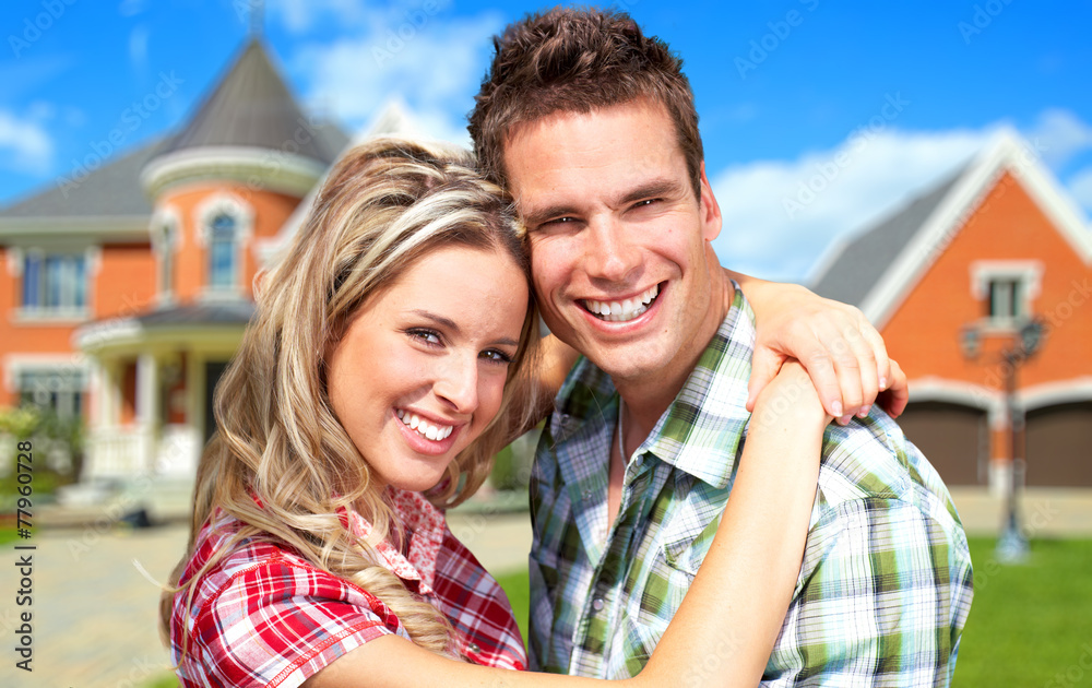 Couple near new house. Couple near new house.